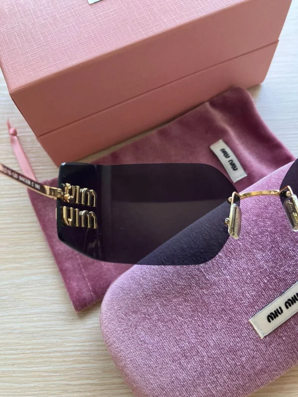 Miu Miu MU54YS Gold Logo Rimless Sunglasses